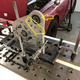 The adjustable assembly that attaches the hybrid system to the vehicle frame.